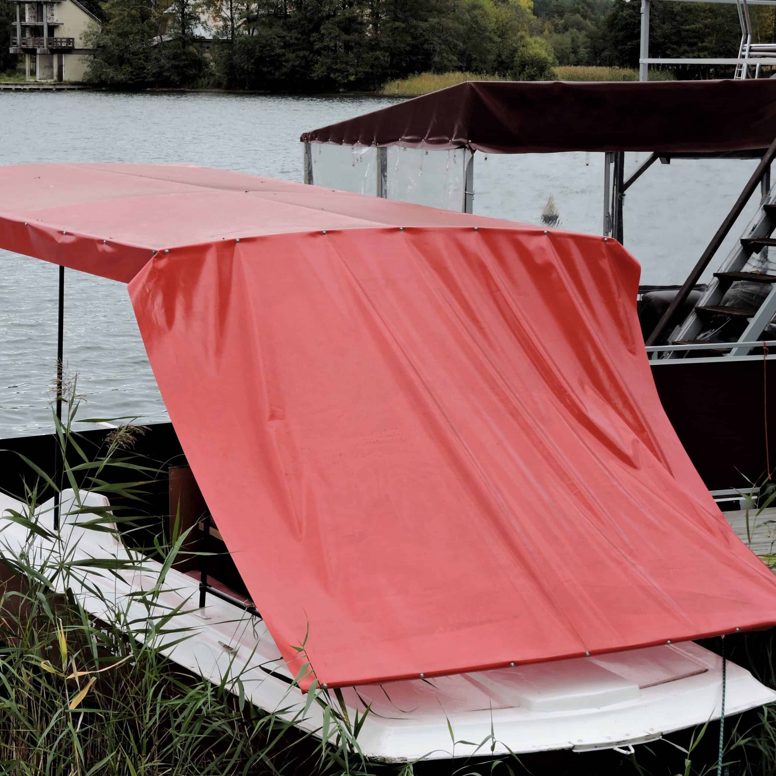 Red,Tarpaulin,Plastic,Sheet,Used,As,Roof,Of,A,Boat